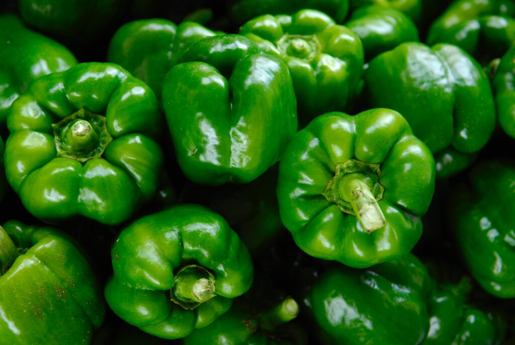 Colorful bell peppers showcasing their vibrant hues in a visually stunning, high-resolution photograph.